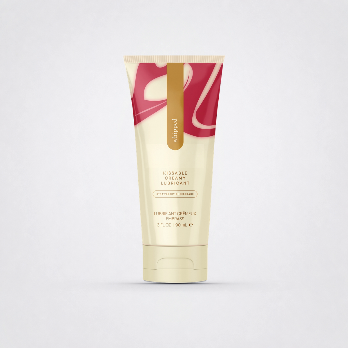 Whipped Strawberry Cheesecake creamy lubricant on The Luv Coach neutral gray studio background