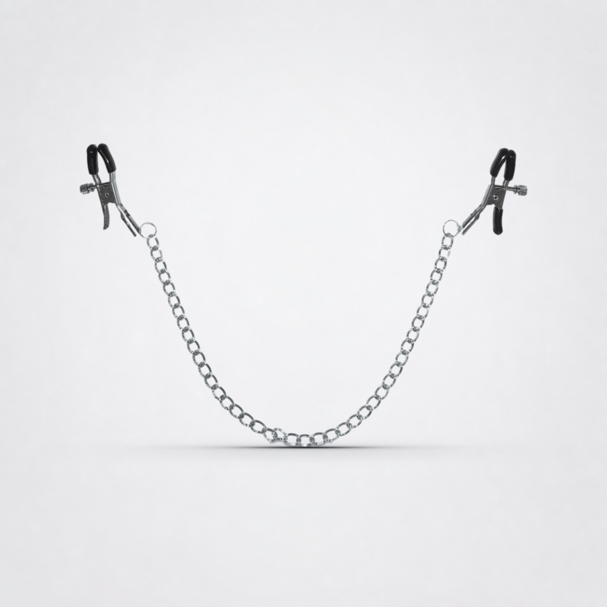 Chained Nipple Clamps on The Luv Coach approved neutral studio background