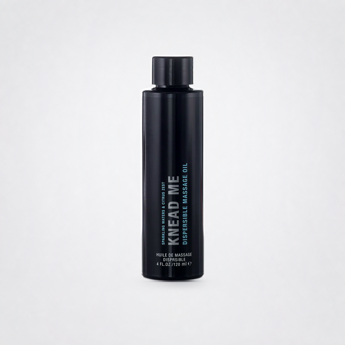 Knead Me Luxury Massage Oil on The Luv Coach approved neutral studio background