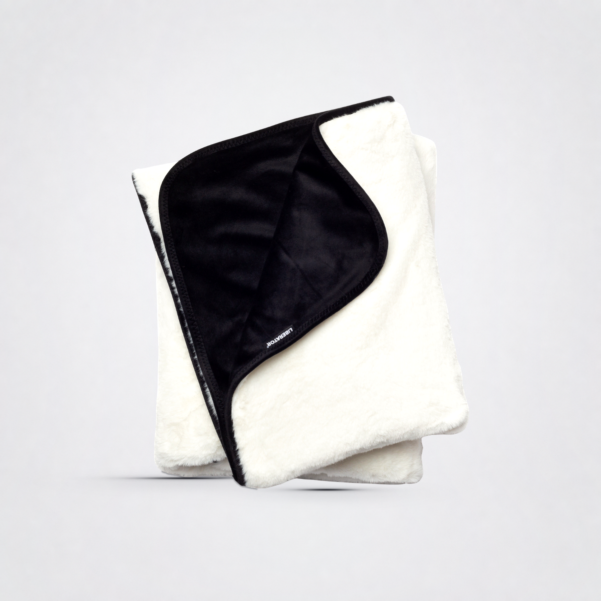Faux Fur Luscious Splashproof Blanket - Fascinator Queen Throw on The Luv Coach approved neutral studio background