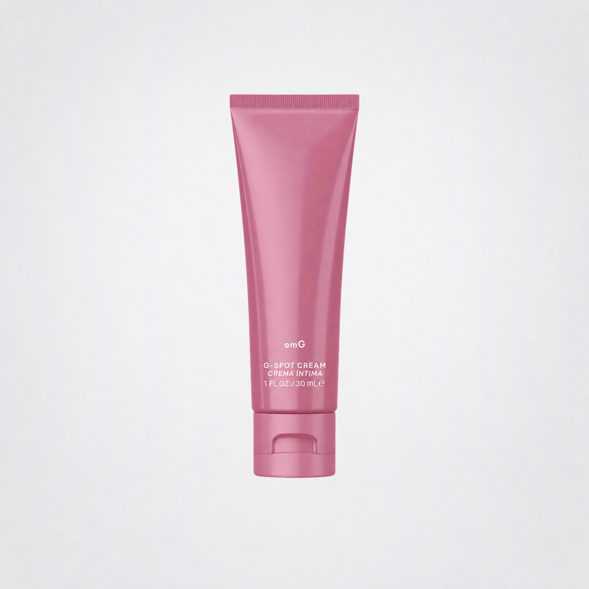 omG G-Spot Enhancement Cream pink tube on grey studio background without a shadow