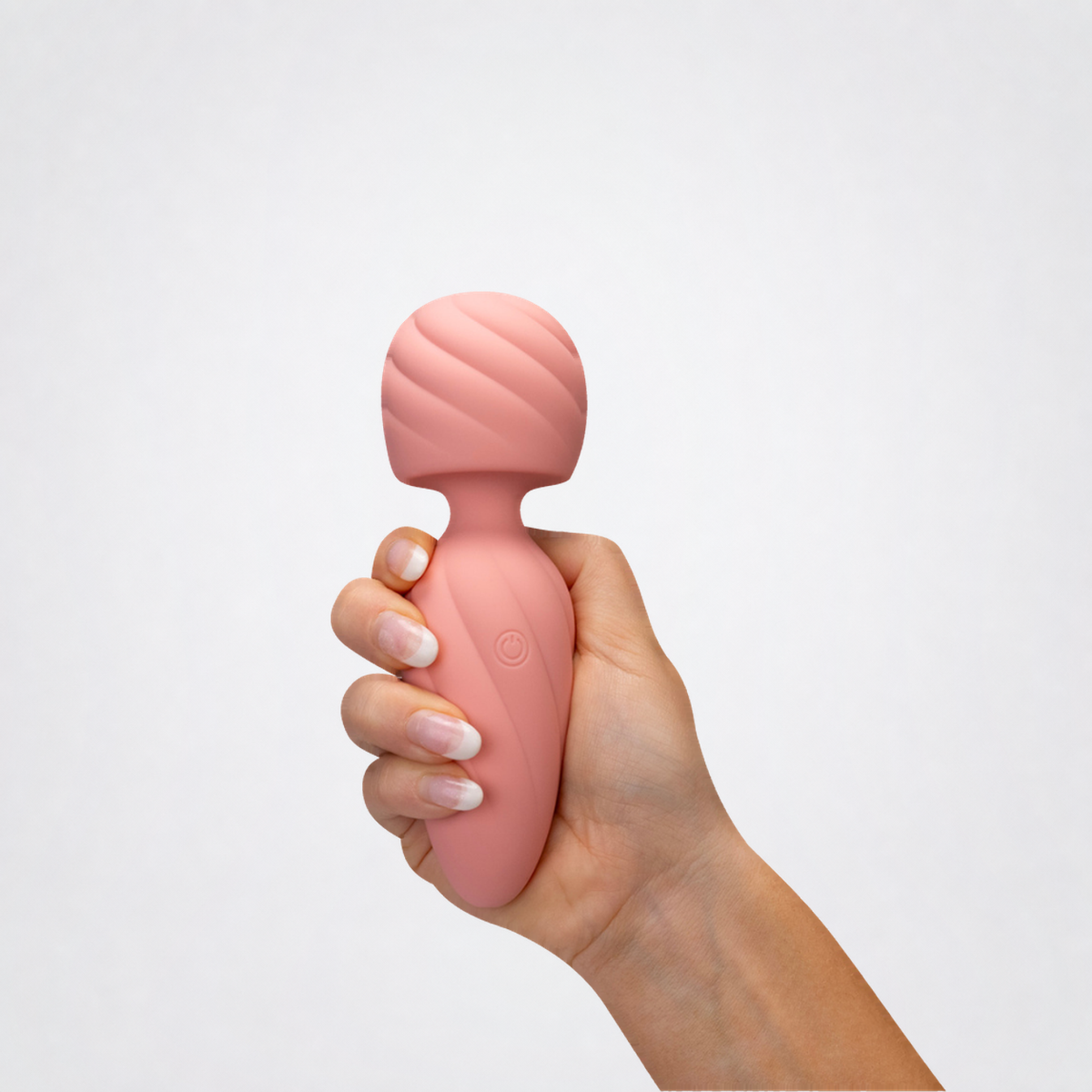 Simply Magic pink wand vibrator held in a hand on grey background