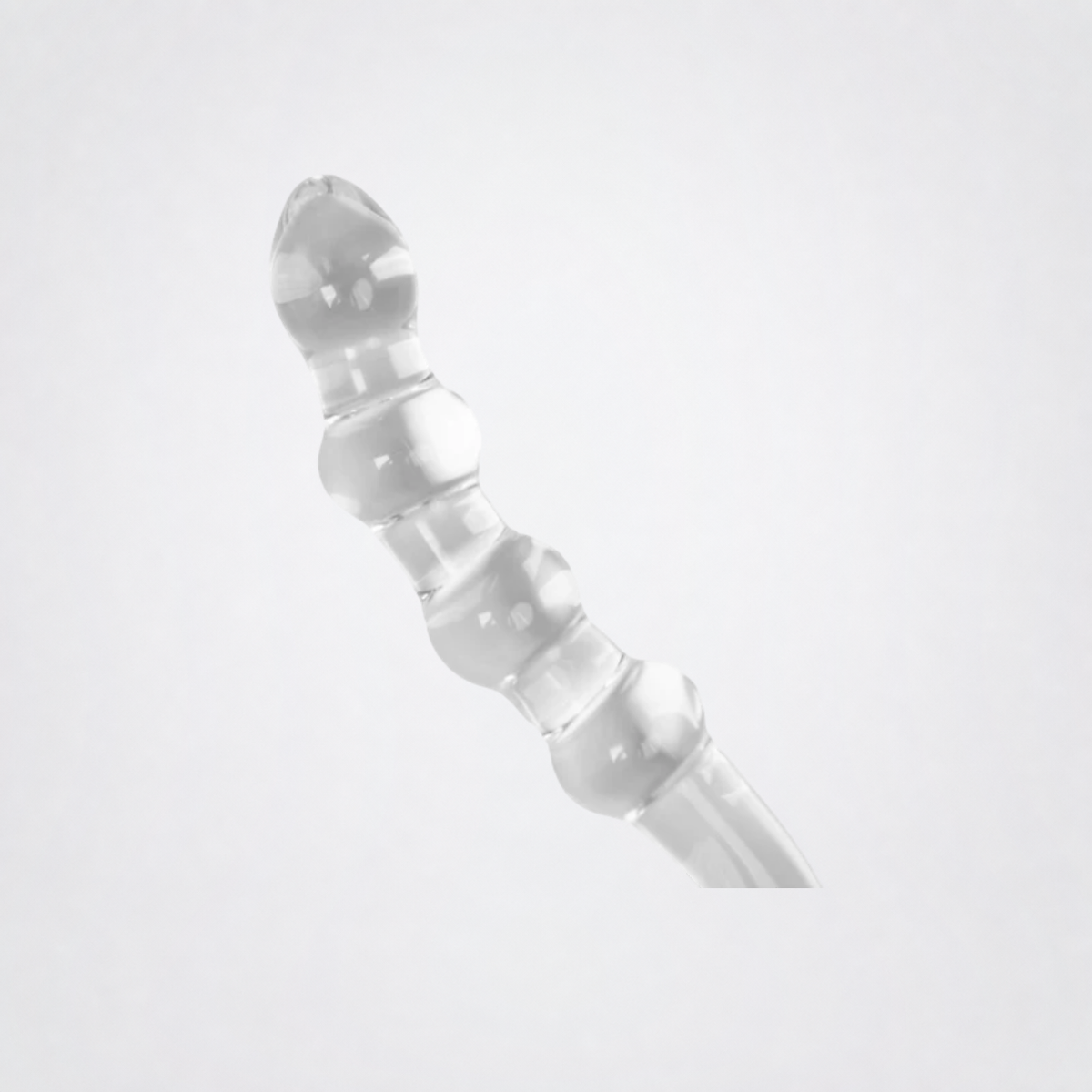 Temp and Tease ribbed glass dildo detail on the Luv Coach grey studio background