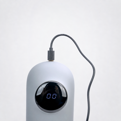 USB-C charging connection for the Total Package Deluxe masturbator on the Luv Coach gray studio background