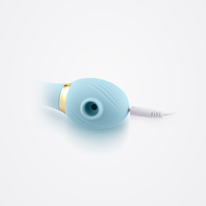 All Inclusive Air Vibe in Blue connected to charging cable