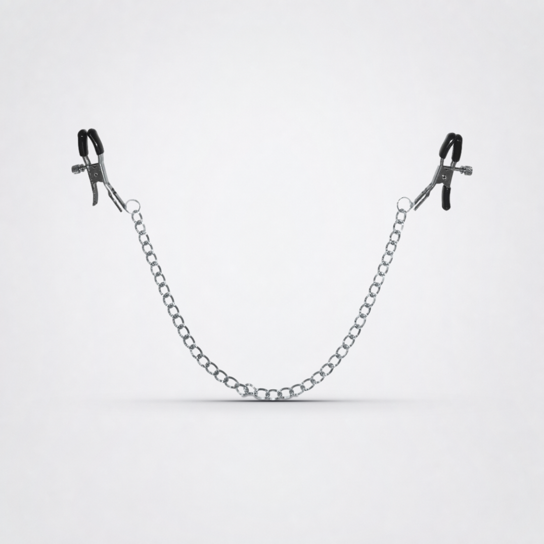 Chained Nipple Clamps on The Luv Coach approved neutral studio background