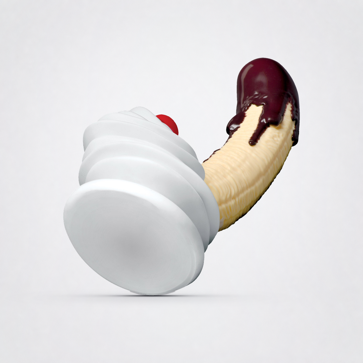 Chocolate Dipped Banana Split dildo with wide suction base on The Luv Coach neutral studio background