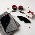 Merry and Wild Kinkmas Box with black and grey Fascinator, leather wrist cuffs, blindfold and mystery toy
