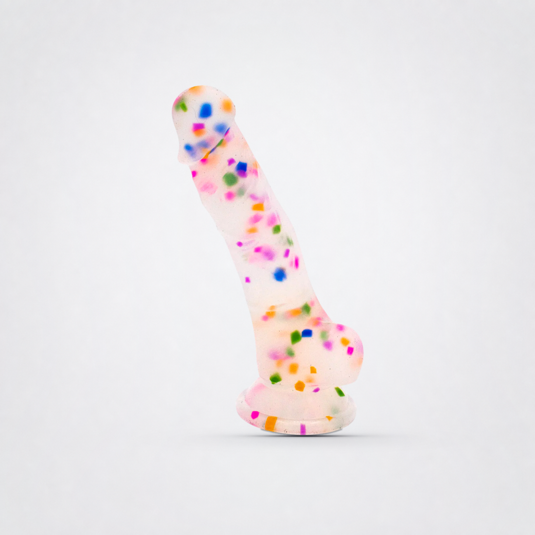 Cock-A-Palooza confetti silicone dildo on a neutral gray background