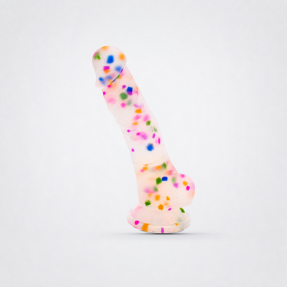 Cock-A-Palooza confetti silicone dildo on a neutral gray background