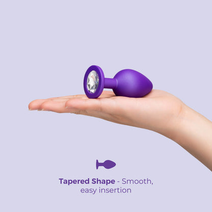 b-Vibe Jeweled Butties Bundle | Purple: Plug shown in a hand for scale