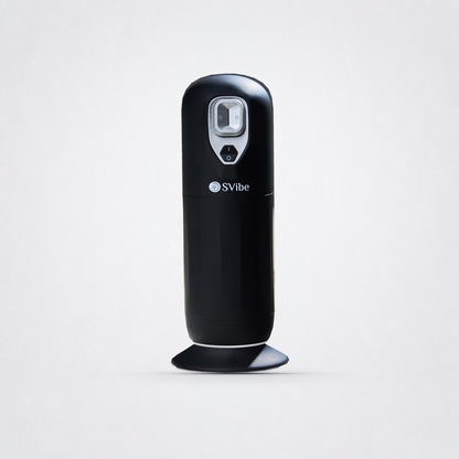 Front view of the black SVIBE JET massager on its MagHeat base on The Luv Coach grey studio background