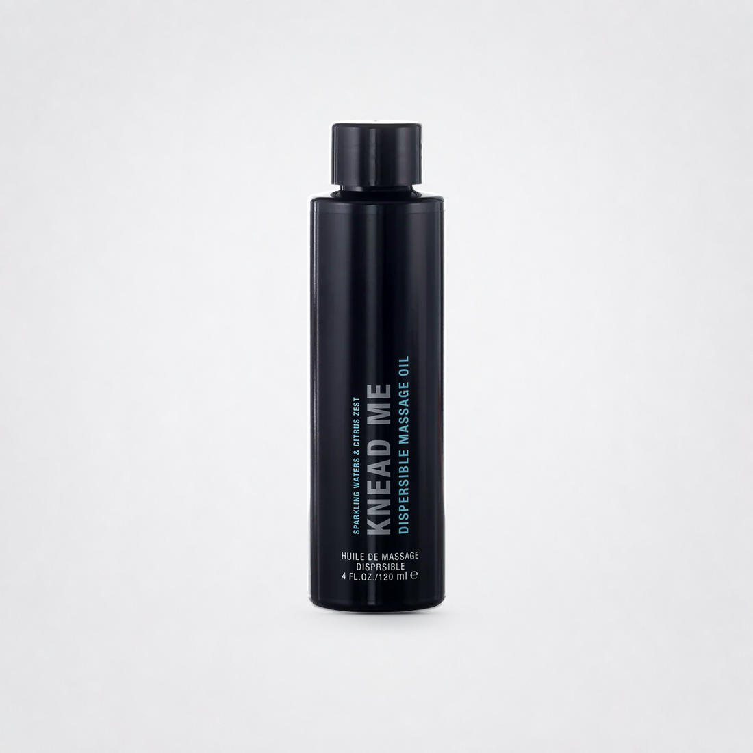 Knead Me Luxury Massage Oil on The Luv Coach approved neutral studio background