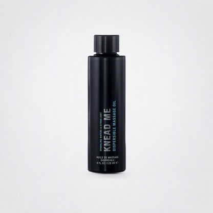 Knead Me Luxury Massage Oil on The Luv Coach approved neutral studio background
