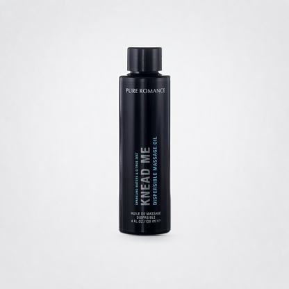Knead Me Luxury Massage Oil on The Luv Coach approved neutral studio background