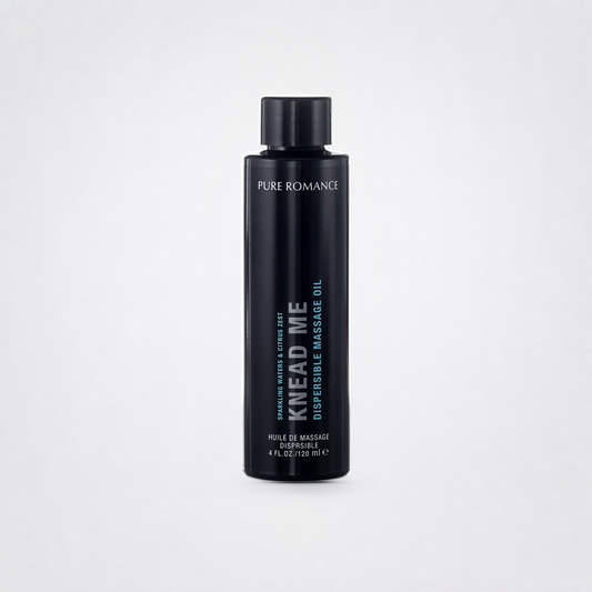 Knead Me Luxury Massage Oil on The Luv Coach approved neutral studio background