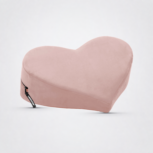 Heart Wedge S*X Position Pillow on The Luv Coach approved neutral studio background