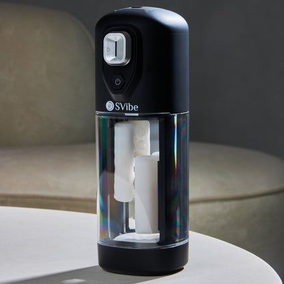 SVibe VOLT standing on a table in a dark lifestyle setting