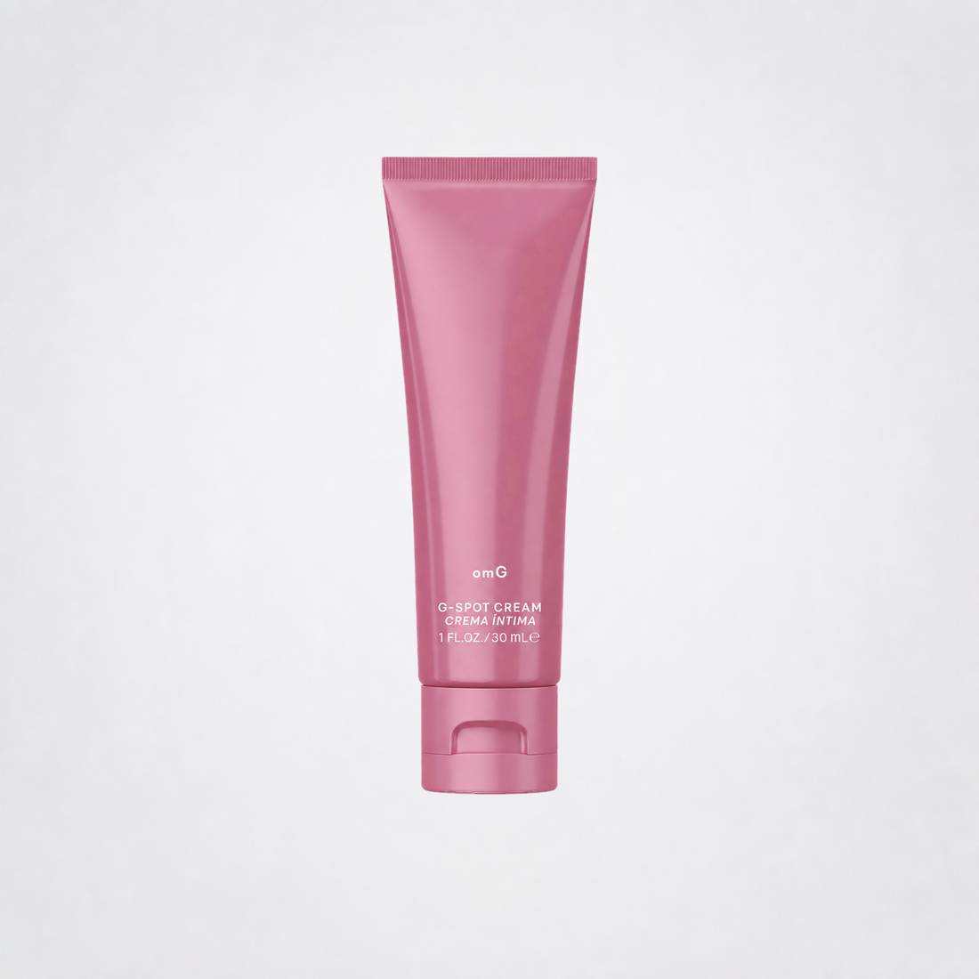 omG G-Spot Enhancement Cream pink tube on grey studio background without a shadow