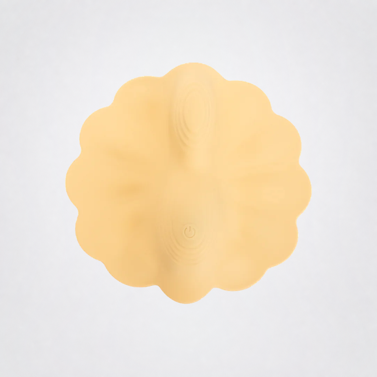 Petal Pleaser textured vibrating grinder detail on the Luv Coach neutral gray studio background