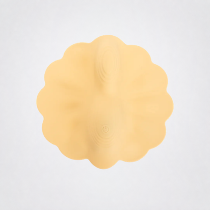Petal Pleaser textured vibrating grinder detail on the Luv Coach neutral gray studio background