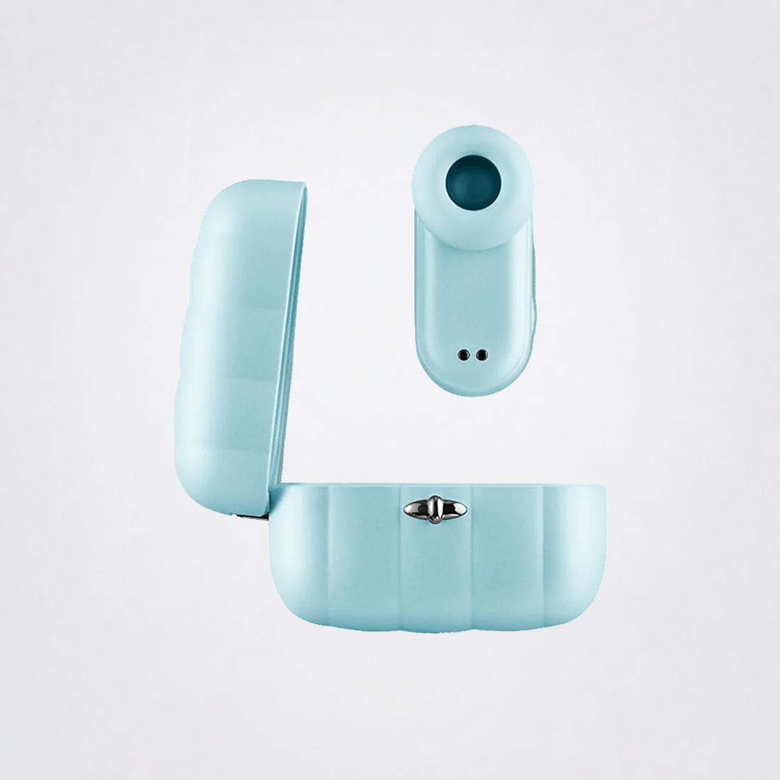 Pleasure Pod Air massager and charging case on The Luv Coach neutral grey studio background