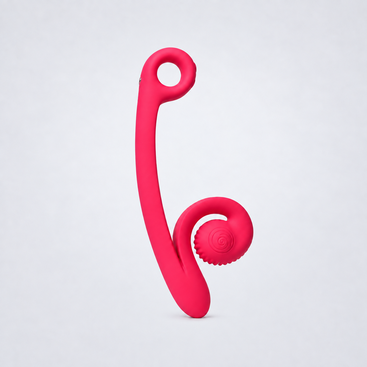Pink Snail Curve dual stimulator on a cool gray studio background