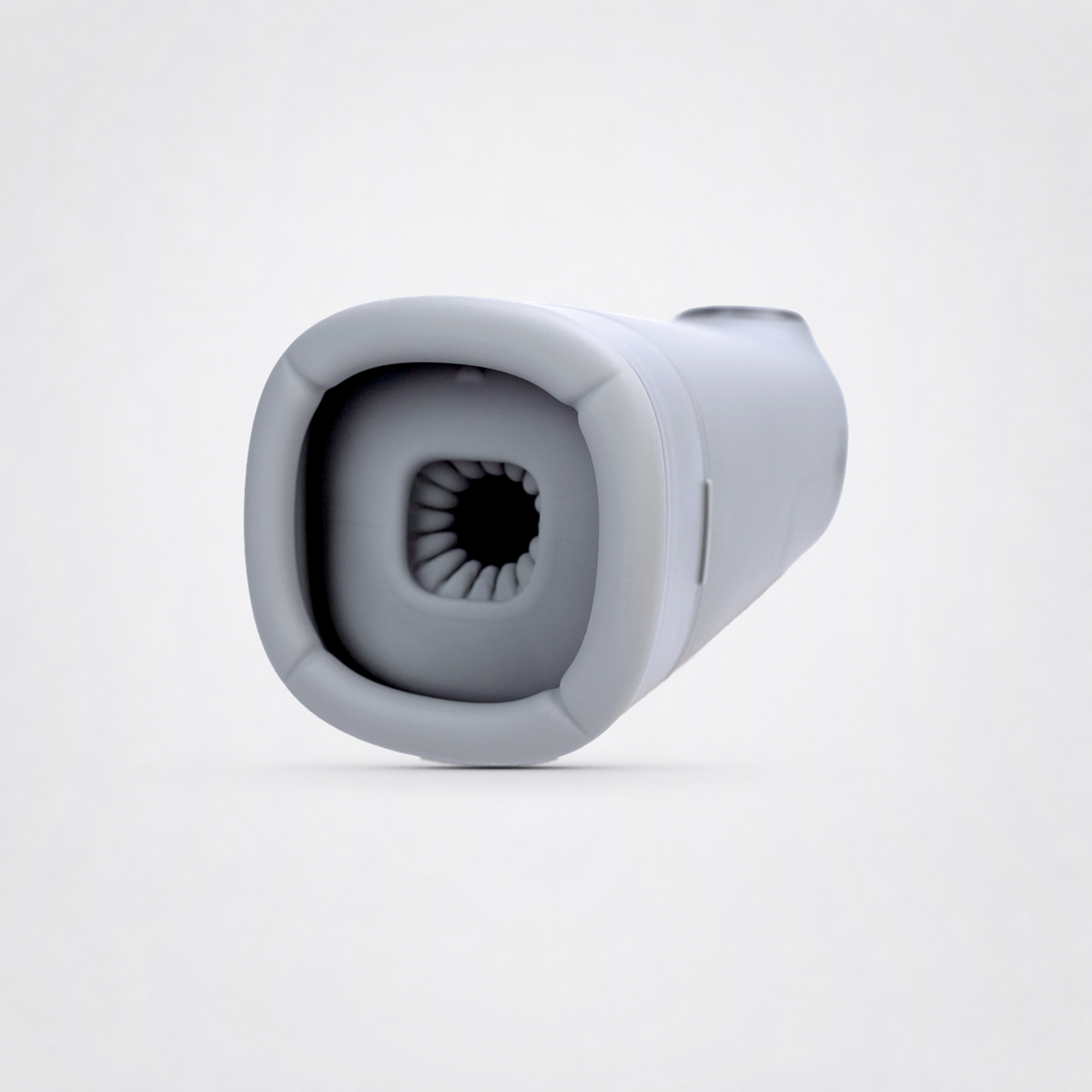 Removable textured sleeve of the Total Package Deluxe masturbator on the Luv Coach gray studio background