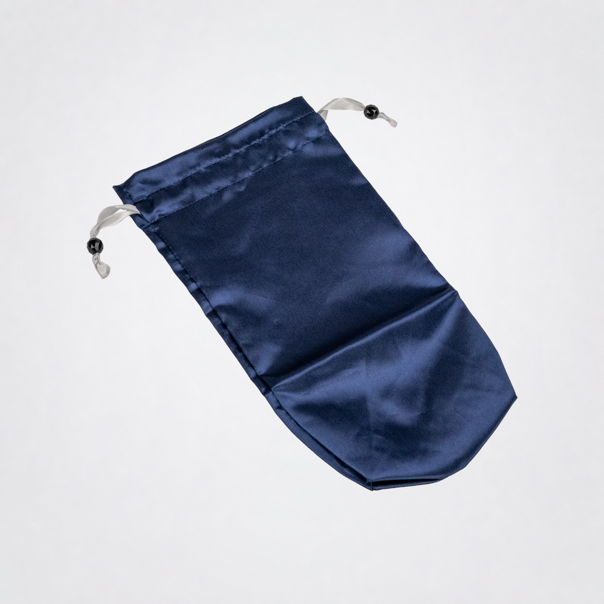 Navy Blue Toy Tote laid flat on The Luv Coach neutral gray studio background