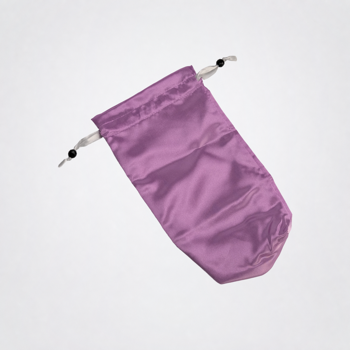Purple Toy Tote laid flat on The Luv Coach neutral gray studio background