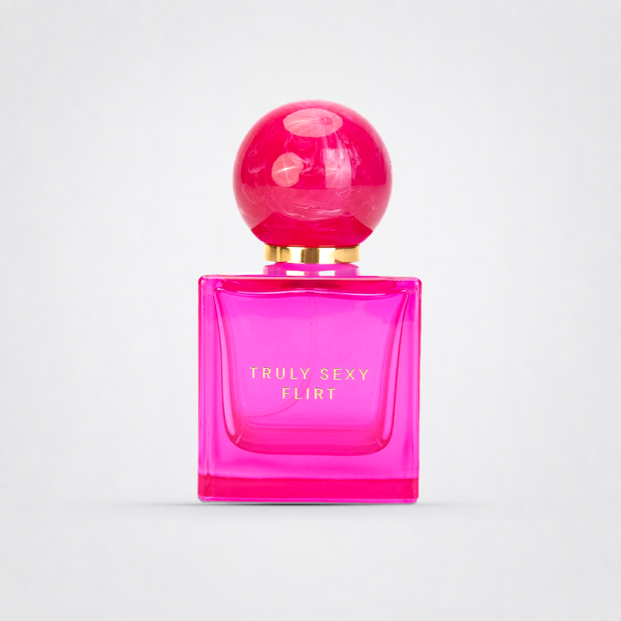 Truly Sexy Flirt Perfume on The Luv Coach approved neutral studio background