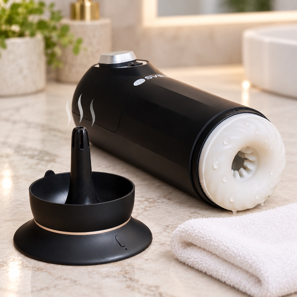 Clean JET removable sleeve, drying base, and towel on a bathroom counter