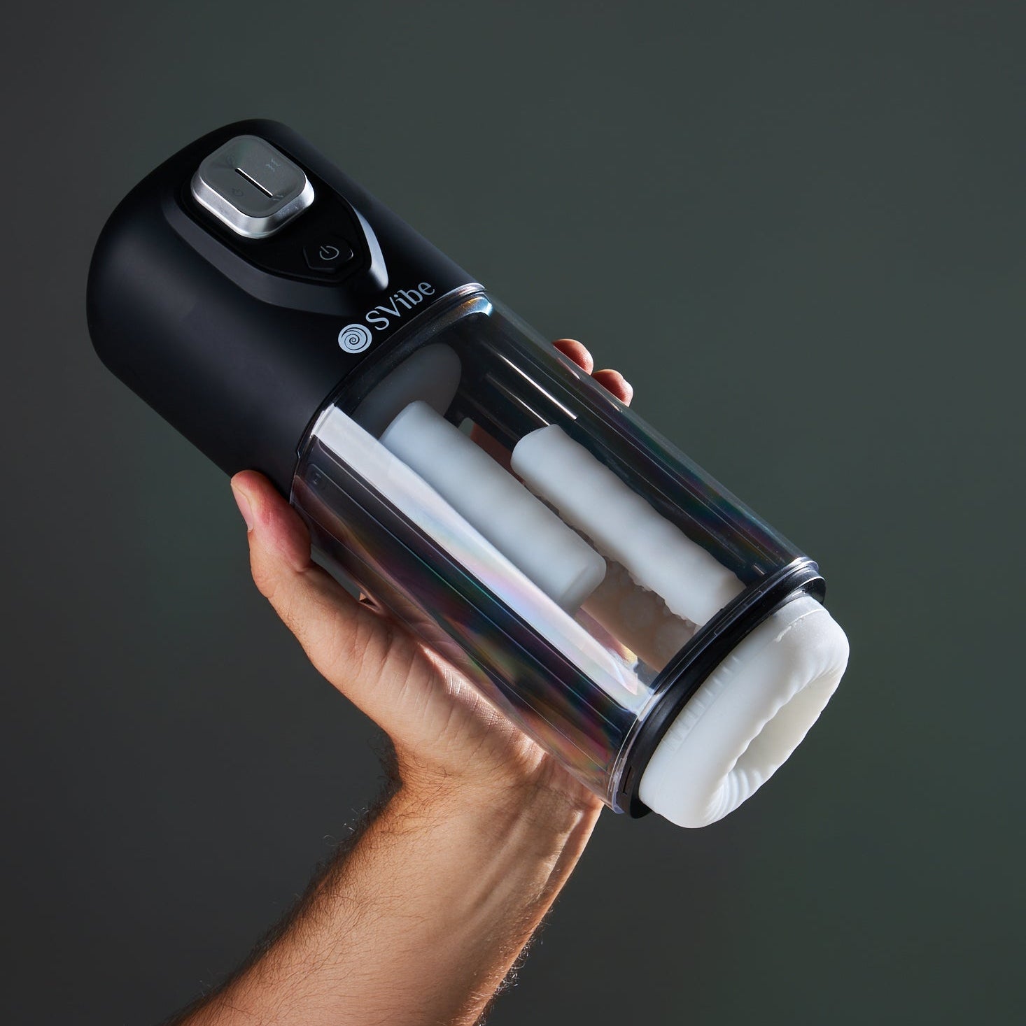 Black VOLT warming multi-motion massager held securely in one hand
